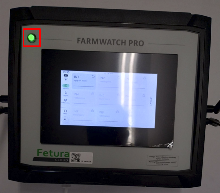 Widok przedstawiający urządzenie FarmWatch Pro z diodą świecącą na zielono.