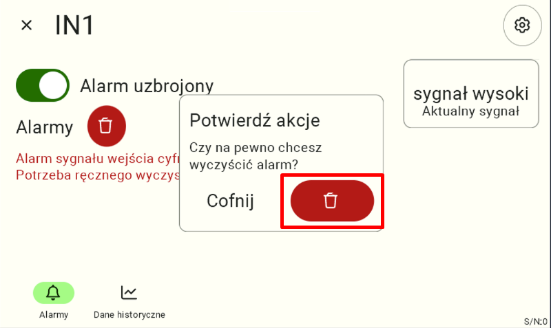 Widok wejścia IN1 z kafelkiem potwierdzającym wyczyszczenie alarmu. Użytkownik musi kliknąć czerwoną ikonę kosza na śmieci, aby potwierdzić akcję.