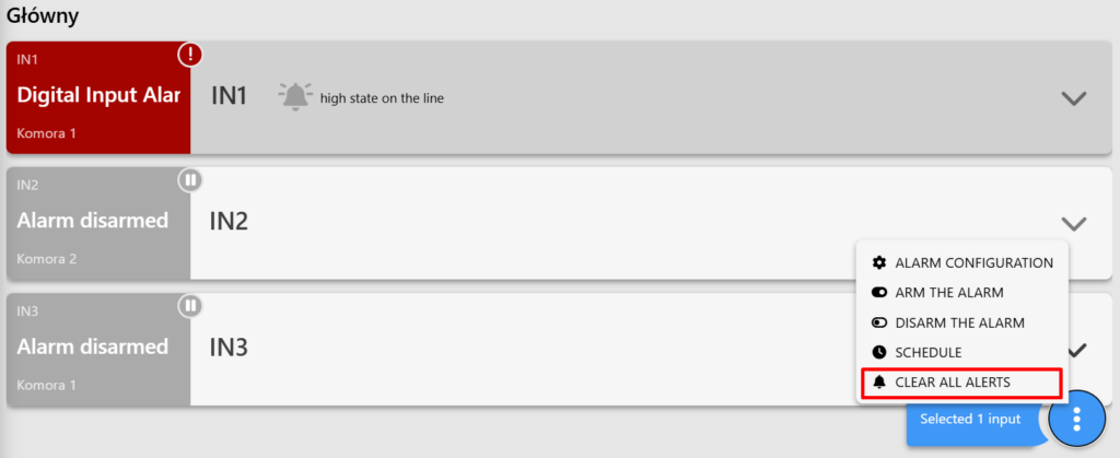 View of the digital input in the Digital Inputs tab. The input status is lit red, indicating an alarm. Three dots are highlighted in the lower-right corner. Clicking the three dots displays the available settings. The "Clear Alarm" option is selected.    