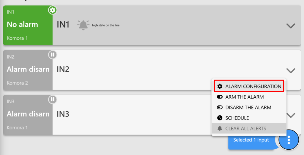 Screenshot of the "DIGITAL INPUTS" tab on the Fetura CLOUD platform. The screenshot shows the digital input panels, with the tabs visible after clicking the three dots. The "Alarm Configuration" option is selected.