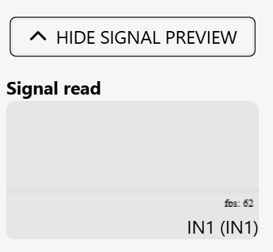 The photo shows the "Show Signal" section open in the alarm configuration panel; "Show Signal" has been changed to "Hide Signal." The signal waveform is visible in low mode, with the caption “Signal Read” above the waveform.