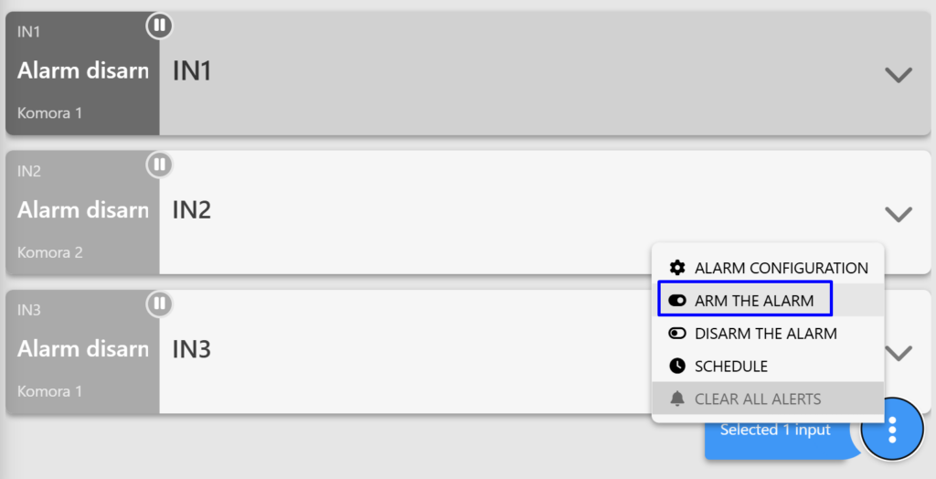 Screenshot of the "DIGITAL INPUTS" tab on the Fetura CLOUD platform. The screenshot shows the digital input panels, with the tabs visible after clicking the three dots. The "Arm Alarm" option is selected.
