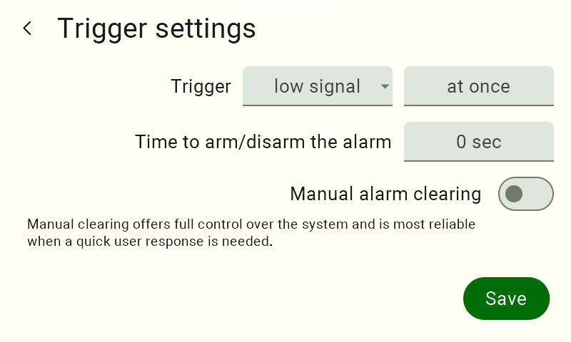 Screenshot of the Trigger settings screen showing Trigger set to 'low signal', mode 'at once', Time to arm/disarm the alarm set to 0 sec, Manual alarm clearing switched off, and the Save button.