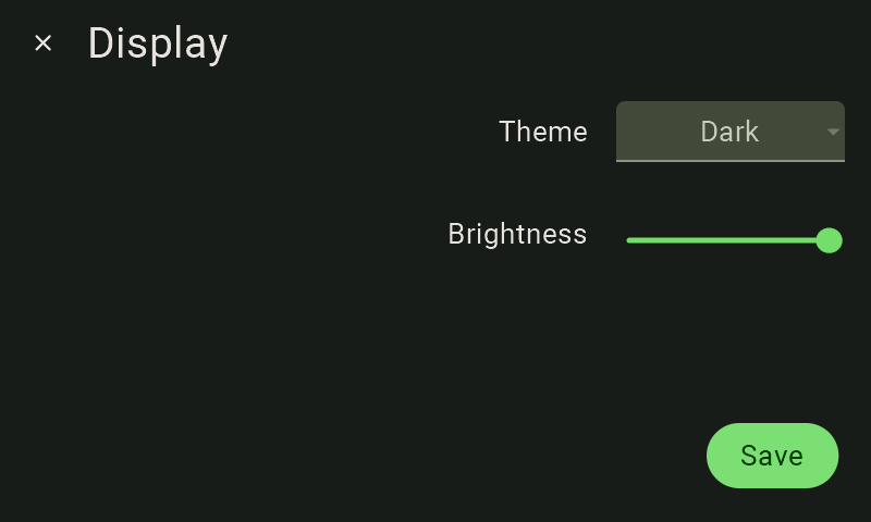 A view of the FarmWatch Pro display settings. In the upper-left corner is the label "Display"; to the right is the label "Theme," and to the right of that is the theme selection tile labeled "Dark." Below that is the label “Brightness,” and to its right is a slider with a green dot positioned all the way to the right.
In the lower-right corner is a green button with the white text “Save.” The screen is in dark mode.
