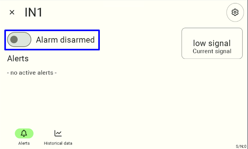 Screenshot of the IN1 detail panel with the 'Alarm disarmed' toggle switch highlighted in blue, used to arm the alarm for this input.